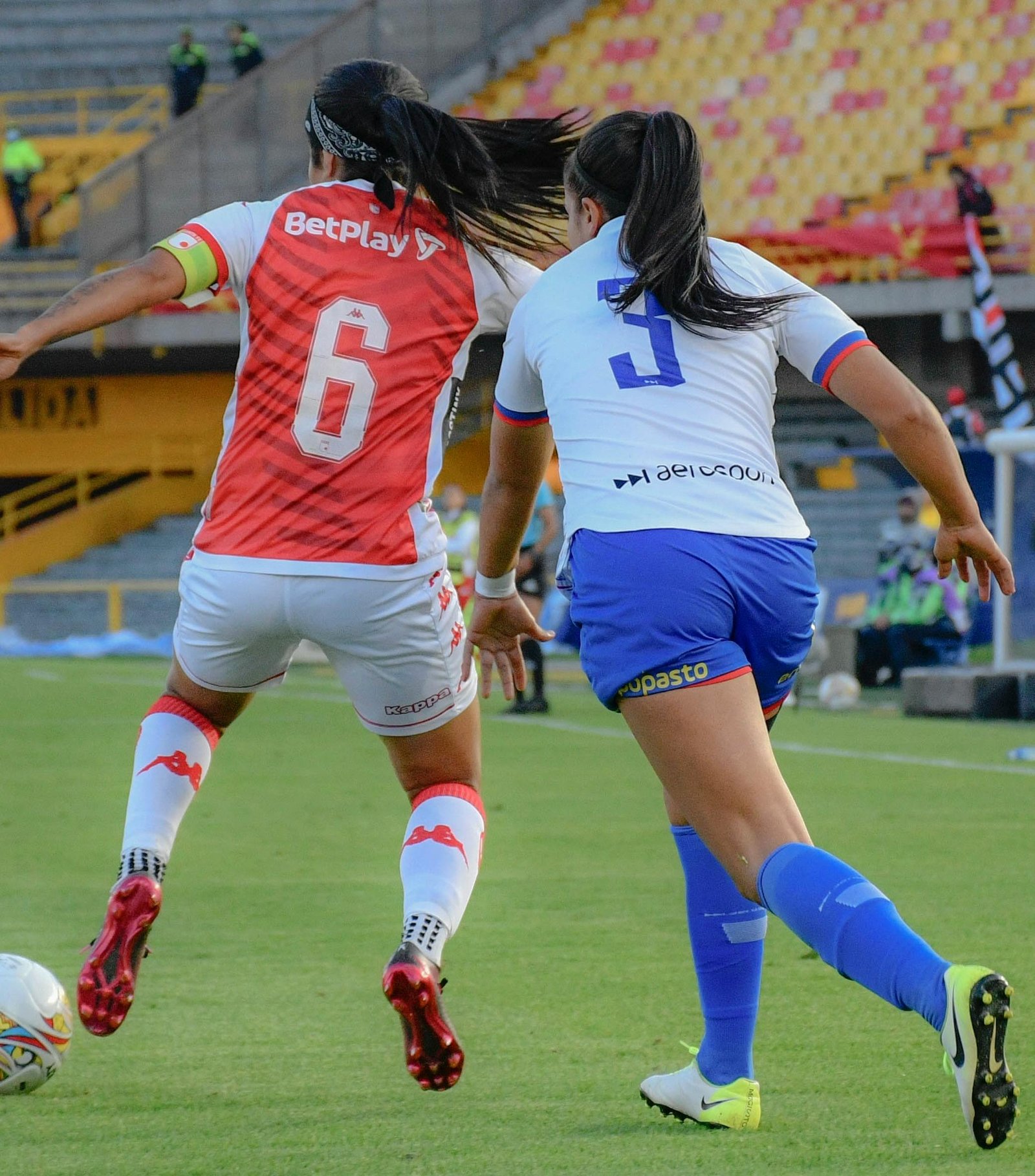 Women's Super League players in action during a match