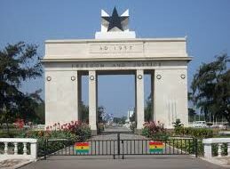 ghana flag and histrorical memorial related to slavery